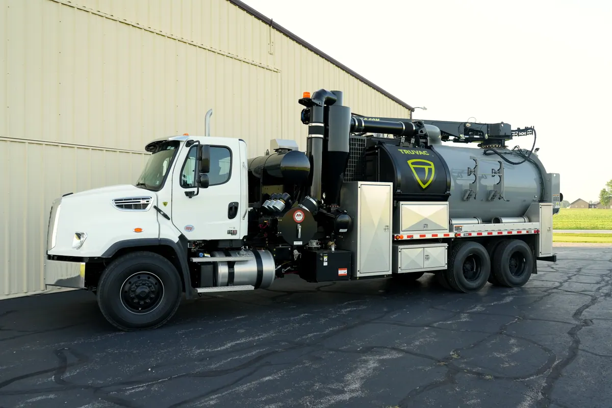 Side view of the TrueVac HXX showing the debris tank, water tanks, and cabinet storage.