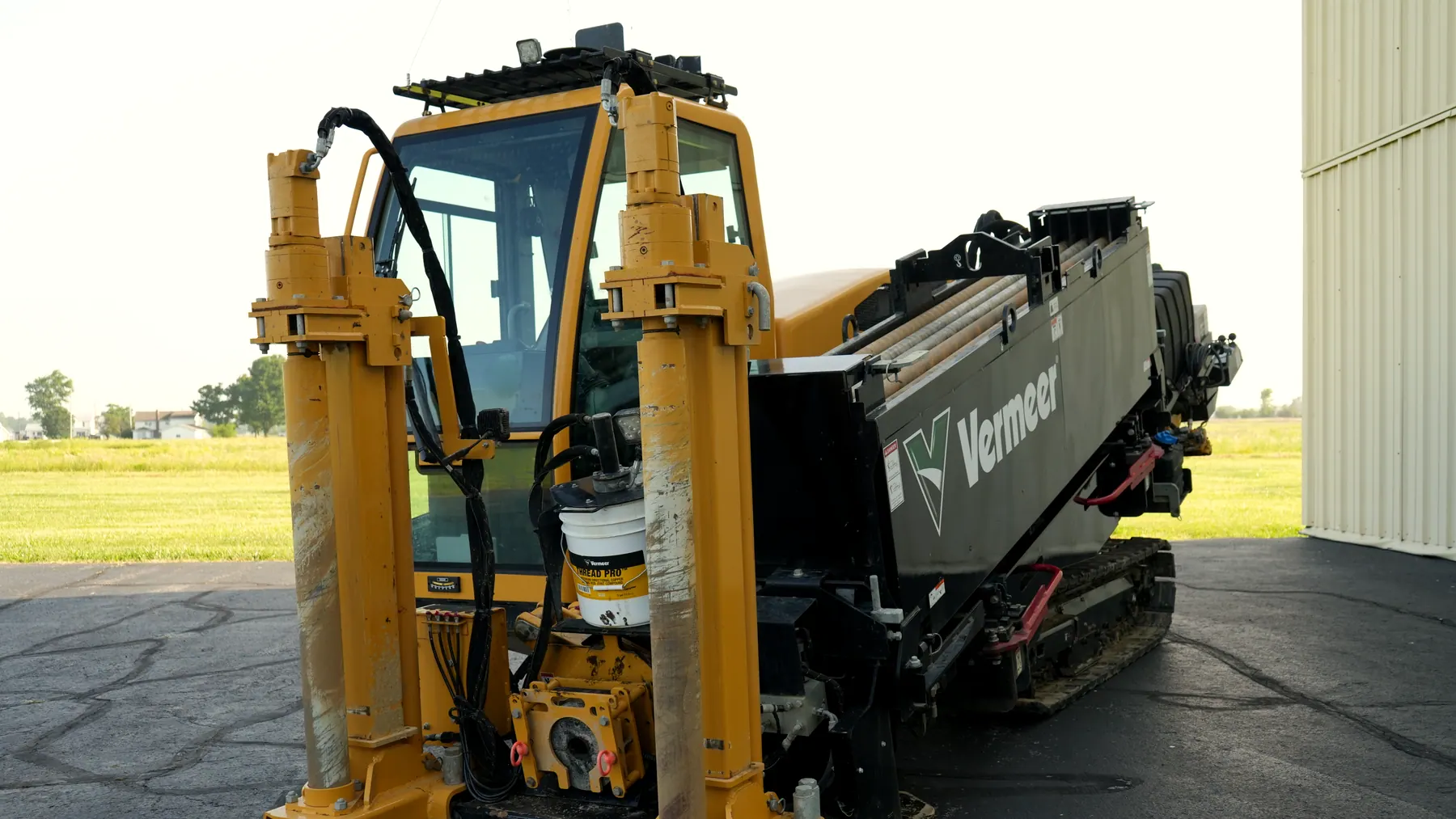 The Vermeer D24x40 S3 directional drill with its anchor stakes down, photographed against open Ohio farmland.